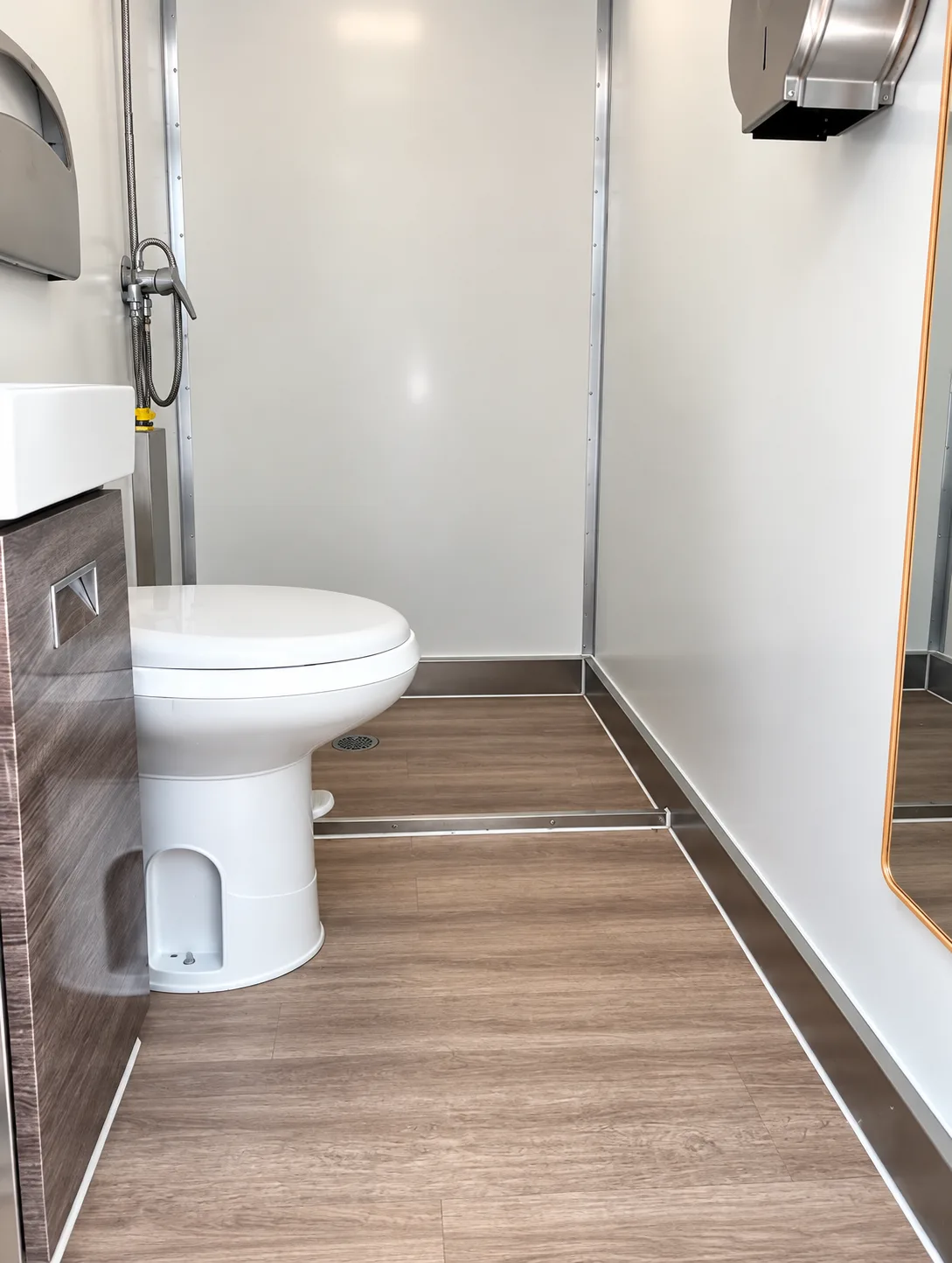 Private shower and restroom compartment inside a combination trailer